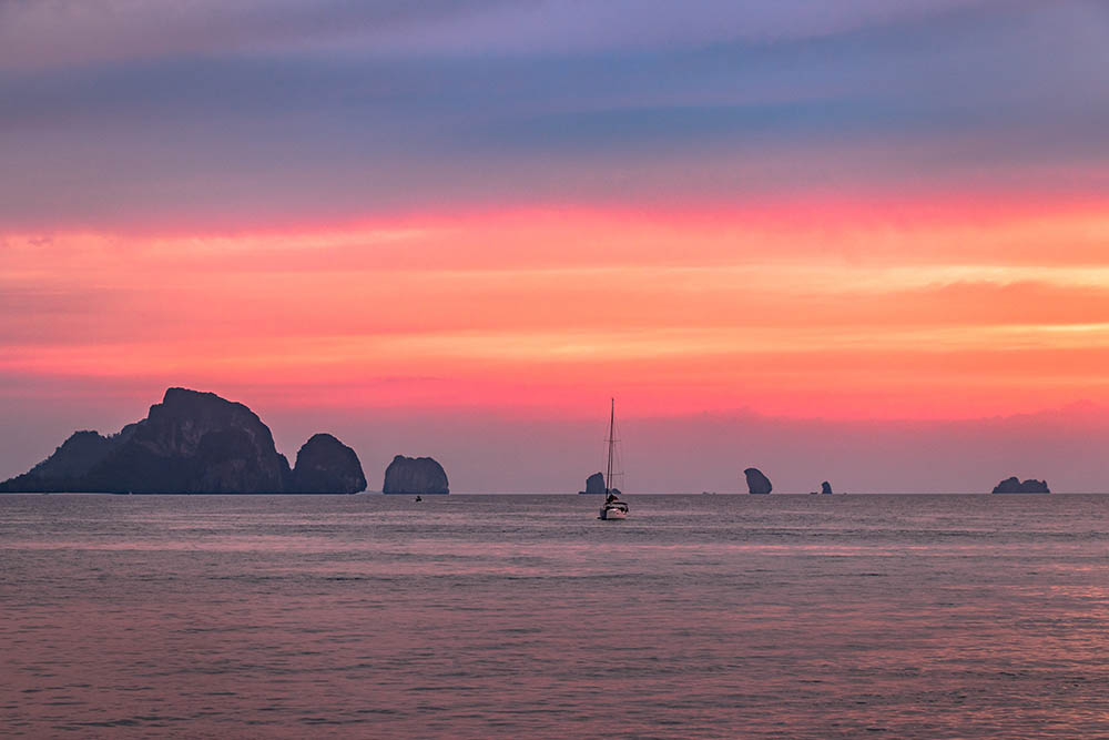 pink sunset across the sea and islands of krabi