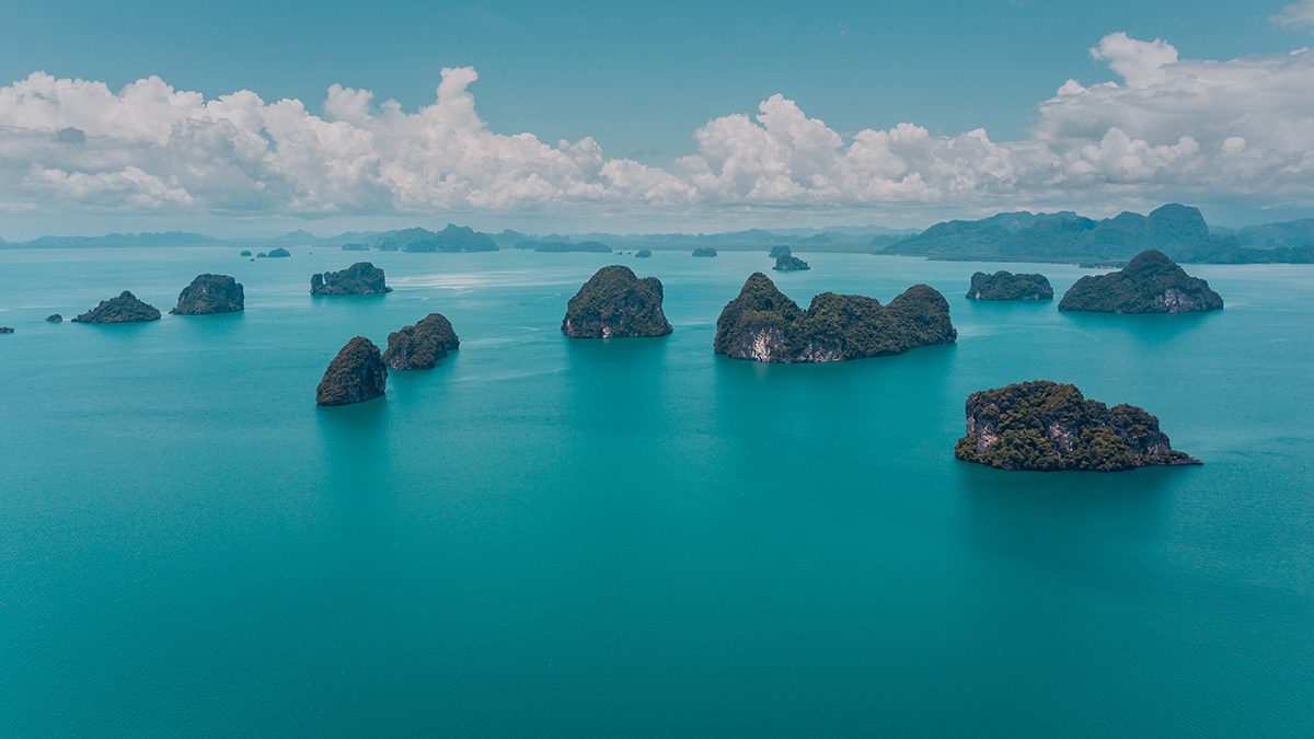 the small island off the shore of krabi, Thailand 5 large islands in the foreground, with more islands and the mainland in the background