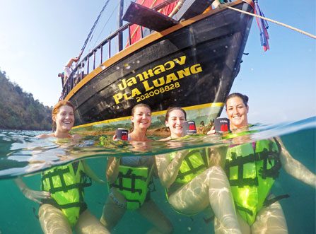 Group of girls in water enjoying the Krabi Sunset Cruises 4 Island Sunset Cocktail Cruise and Bioluminescent Night Snorkel