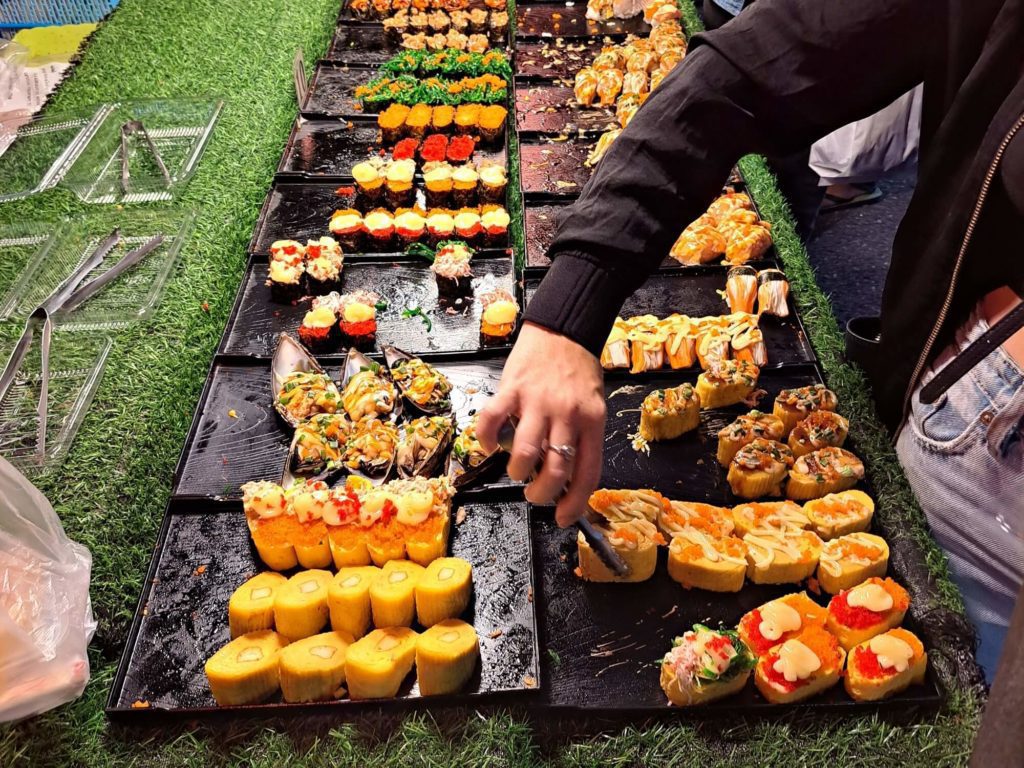 rows of 10 baht sushi at krabi night market