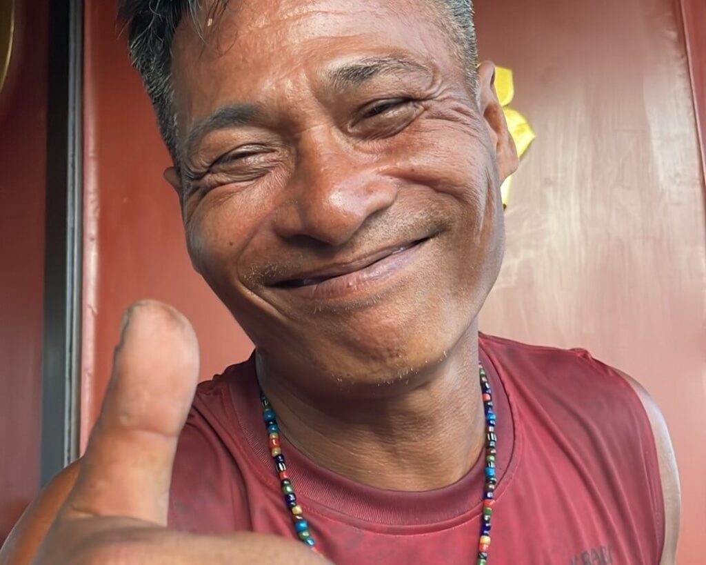 captian of krabi sunset cruises giving a close thumbs up to the camera