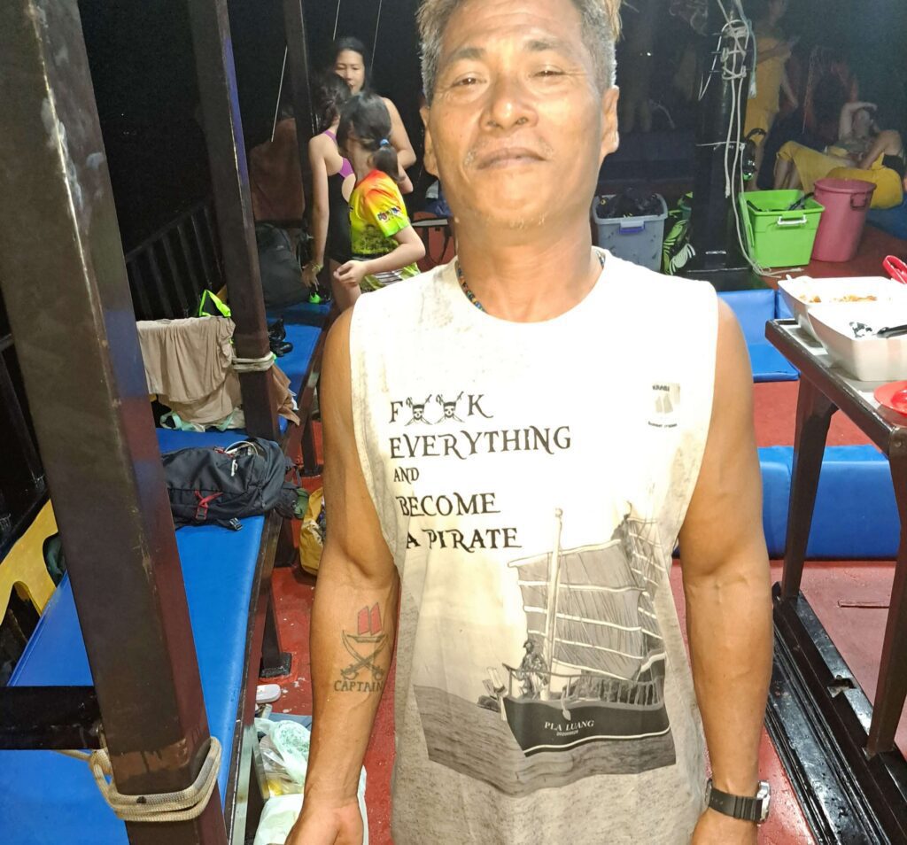 krabi sunset cruise captain with his captain tattoo